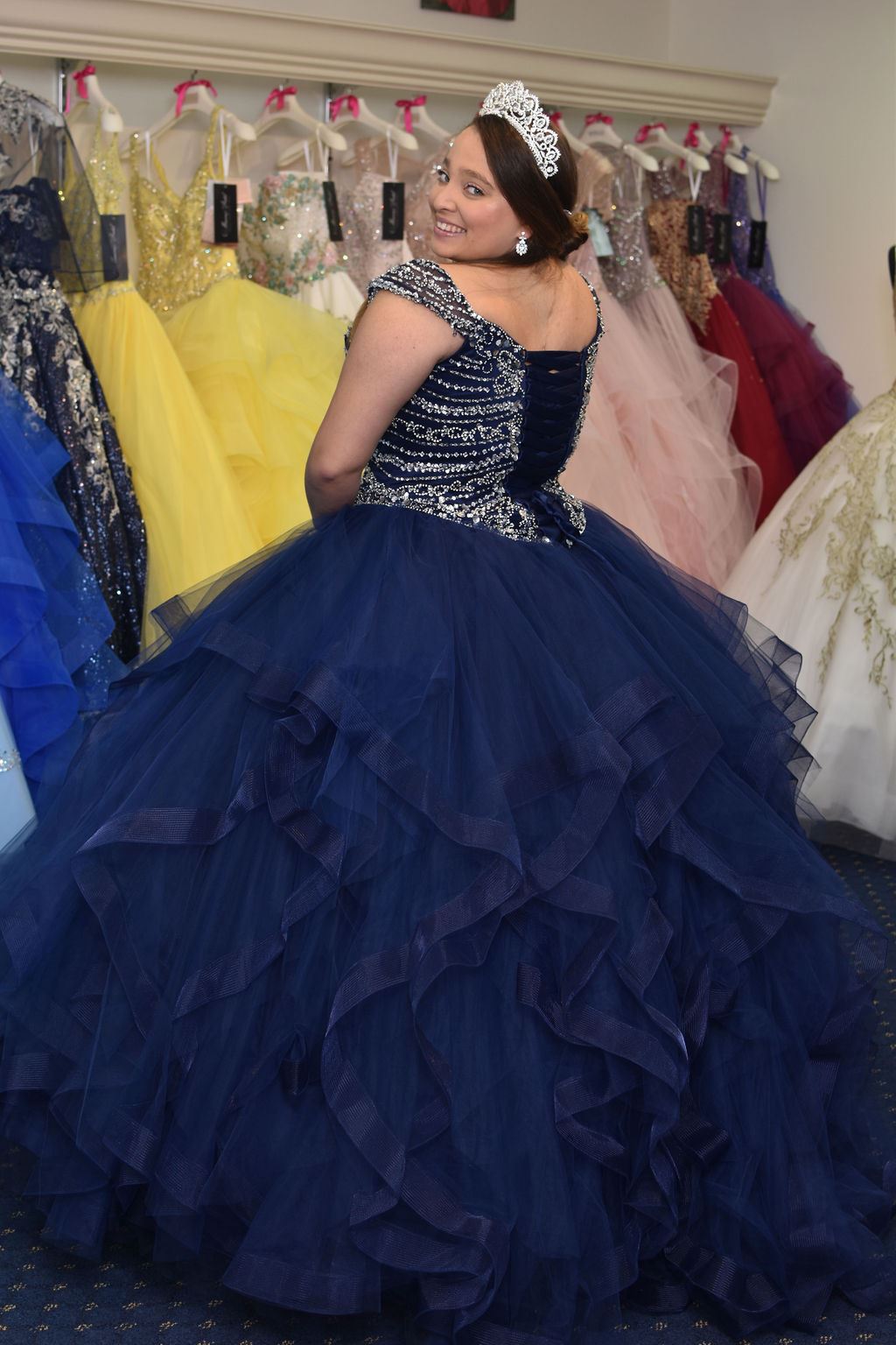 Model wearing a dark-blue gown